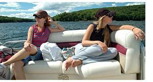 Ladies enjoying a ride in a pontoon boat.